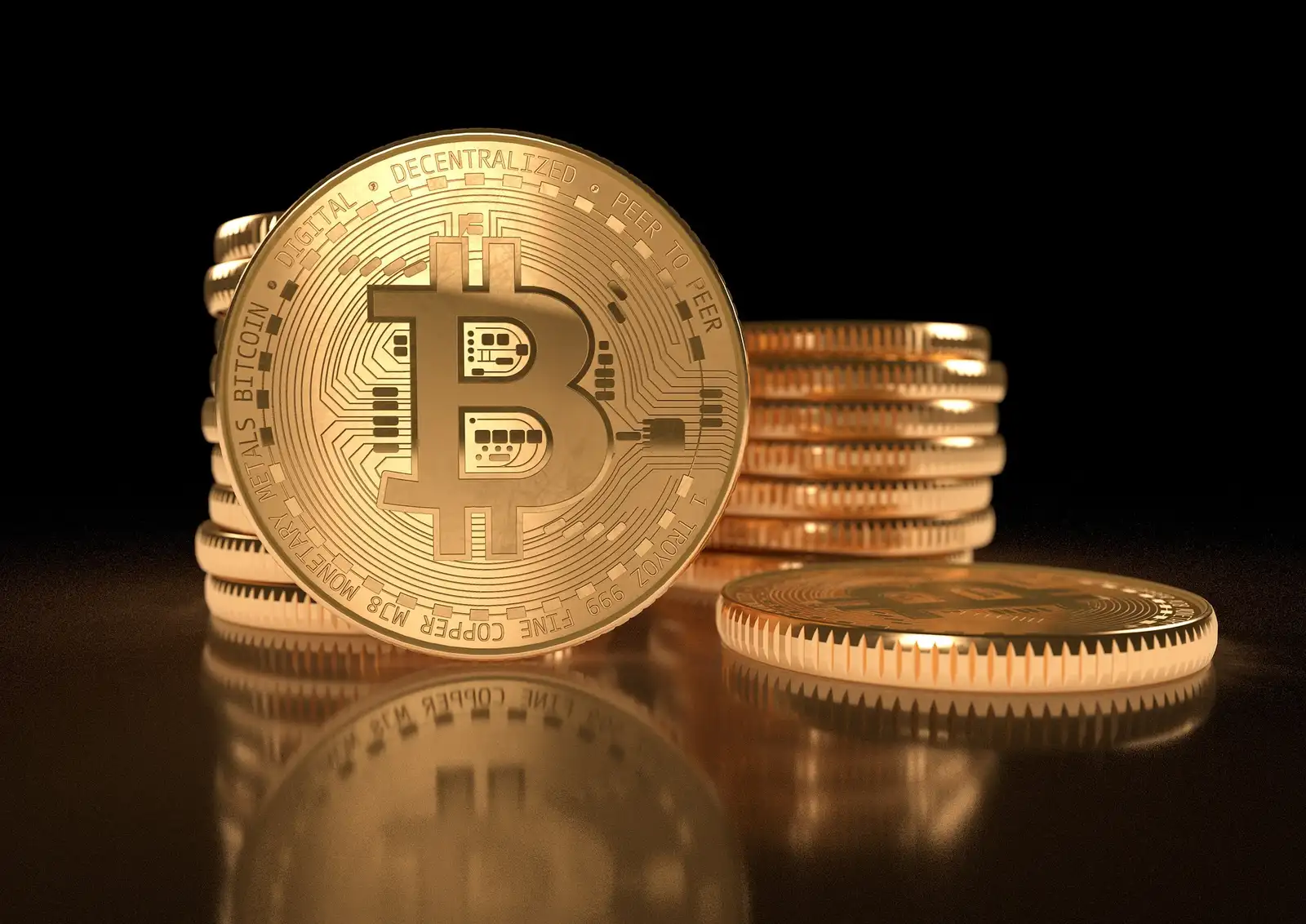 Bitcoin token photographed on a dark surface, representing a funded Bitcoin wallet
