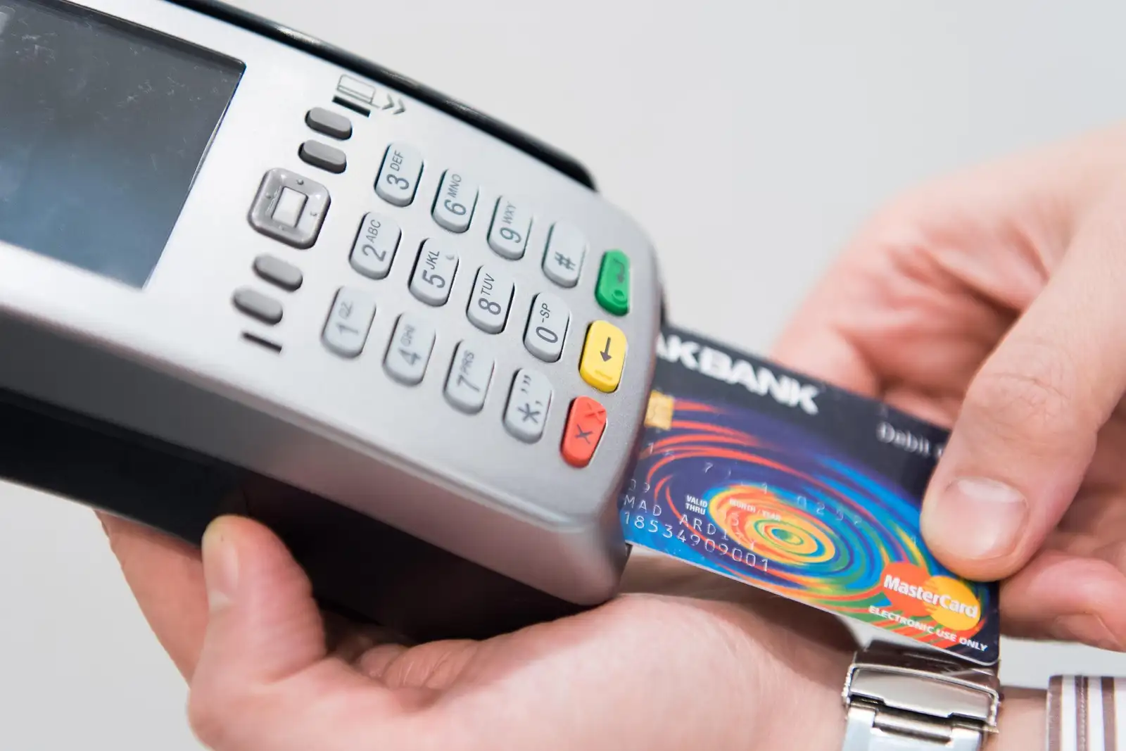 Payment terminal in a New Zealand retail setting, illustrating buying a hardware wallet locally rather than importing it